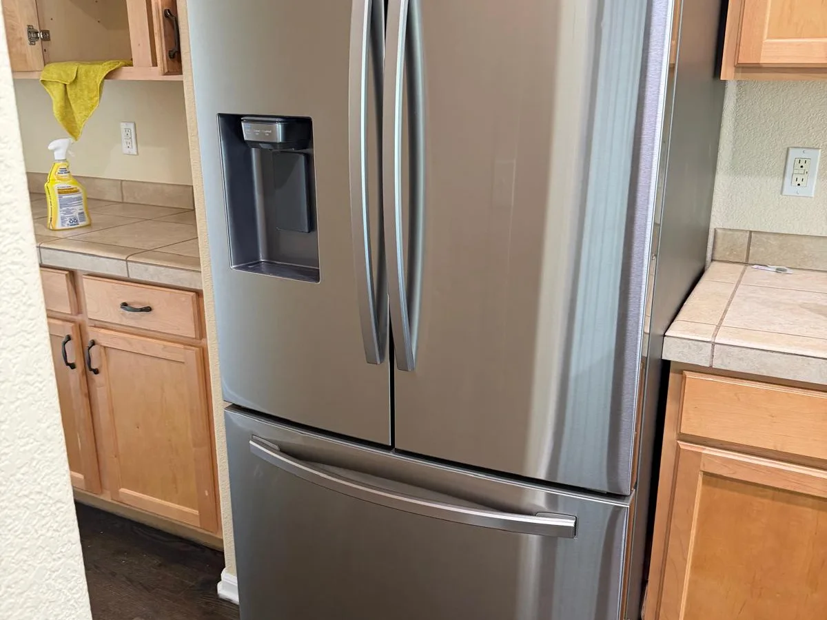 Kitchen with a cleaned stainless refrigerator